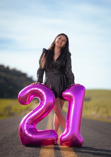 birthday girl posing for her birthday photo portraits taken by a professional photographer