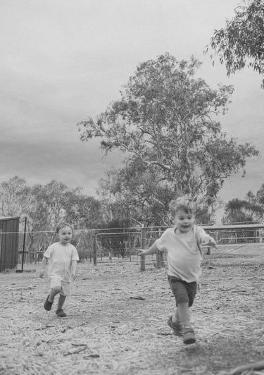 toddler friends running towards the camera in Adelaide Hills 