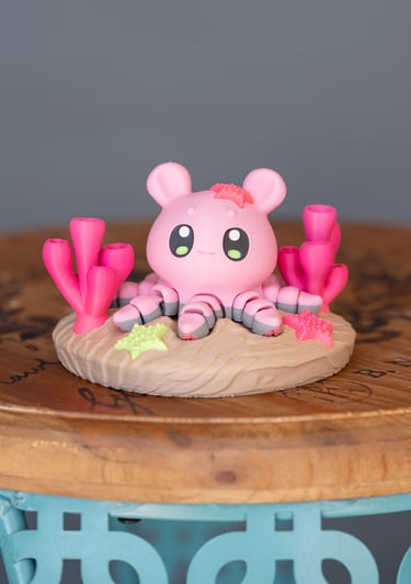 image of 3d printed pink octopus on a display circle