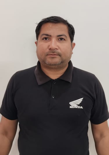 a man in a suit and pink shirt