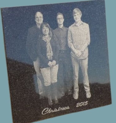 Polished granite with engraved image of a family of 4