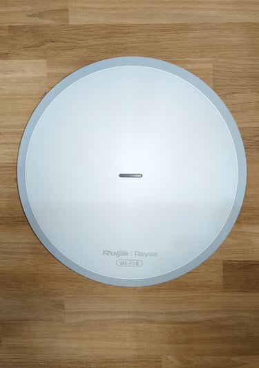 a round white clock with a white clock on it