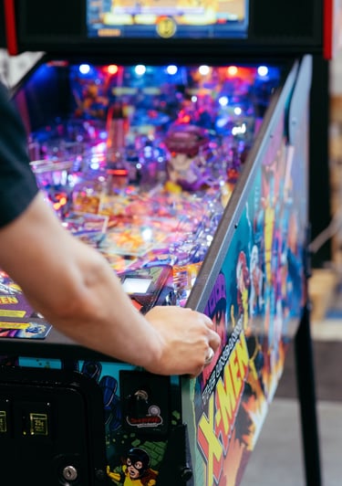A pinball machine is being played