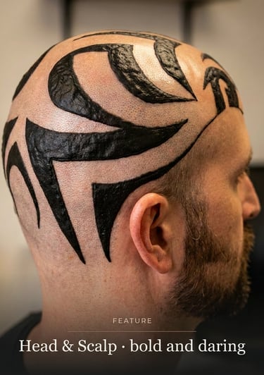 Bold black tribal tattoo design on a shaved head and scalp of a man.