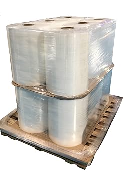 Strapping machine applying PET straps to export pallets