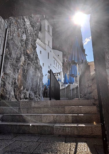 a stairway way to a building with umbrellas