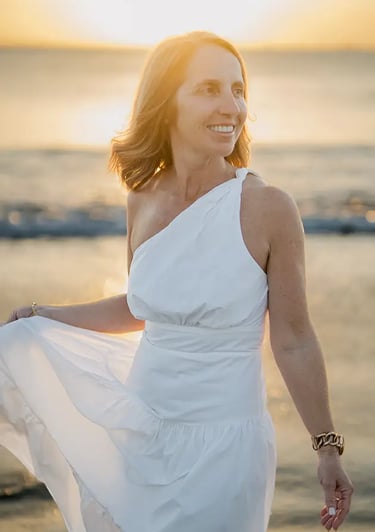 Mother smiling during a golden hour family photography session at Jimbaran Beach Bali