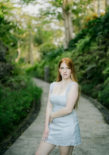 Mother portrait surrounded by tropical greenery during a family photography session at AYANA Resort Bali