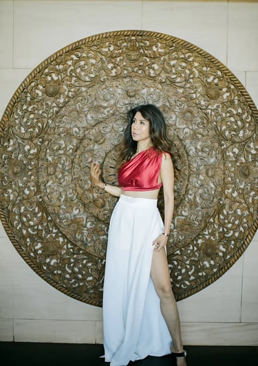 Elegant portrait session featuring Balinese carved architecture at The Apurva Kempinski Bali