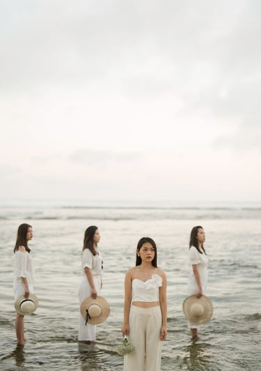 Bachelorette party group standing in ocean water at Melasti Beach Bali