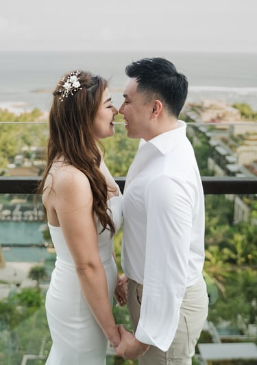 Romantic couple portrait overlooking the ocean during a prewedding photoshoot at Apurva Kempinski Bali