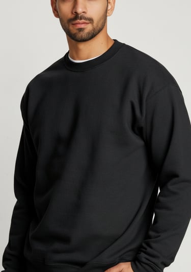 a man in a black sweater and jeans jeans
