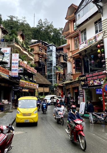 a yellow taxi cab driving down a street