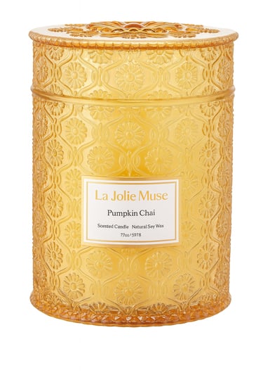 A matte orange ceramic candle jar with a matching lid, captured in clear details