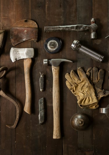 a variety of tools and tools on a wooden table