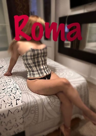 a woman in a plaidered top and panties on a bed