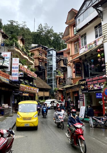 a yellow taxi cab driving down a street