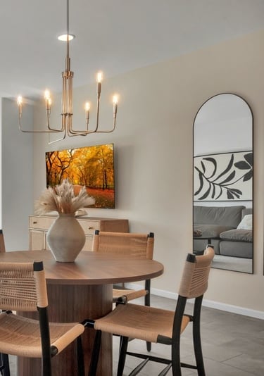 a dining room with a table and chairs