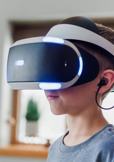 A boy wearing a virtual reality headset