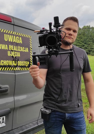 a man holding a camera and a camera