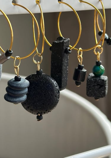 Rosevale Accessories handmade gemstone wine charms on jewelry display