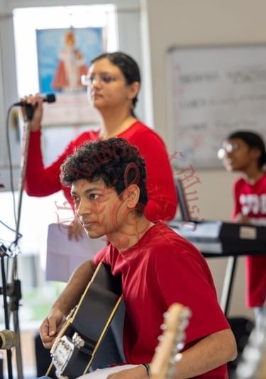 Students interacting with the elderly via music.