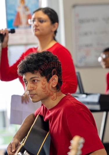 Students interacting with the elderly via music.