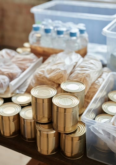 Canned grocery items and water bottles
