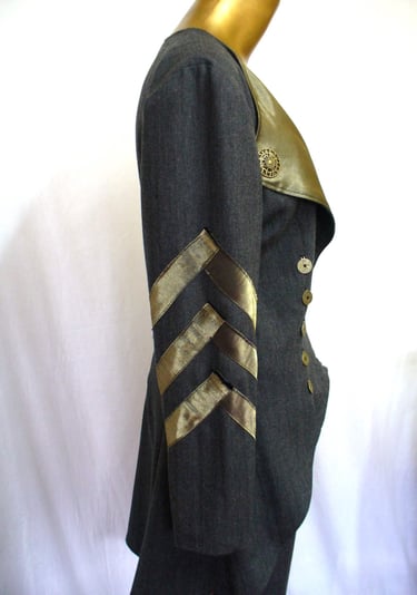 Accents of chevrons on coat sleeve