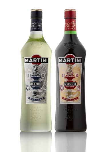 Two Bianco and Rosso Martini bottles side by side on a white background with reflections