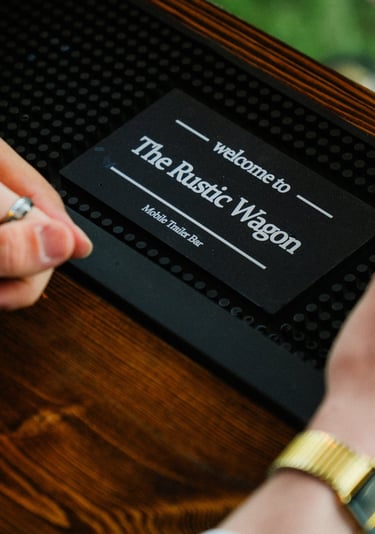 Couples holding hands in the background of The Rustic Wagon