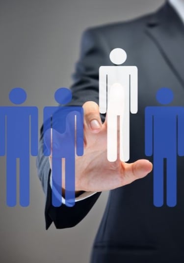 a man in a suit and tie is holding a paper cutout of a person