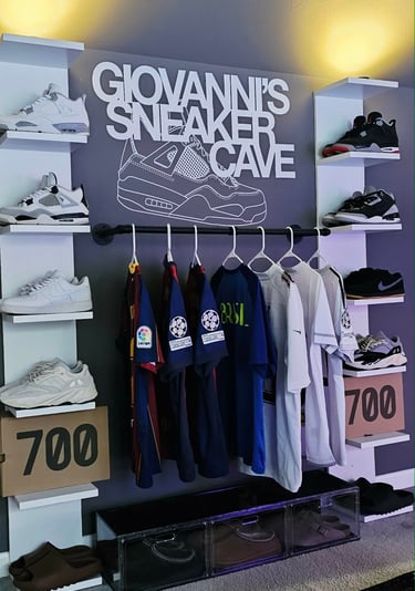A stylish sneaker display with various shoe styles and sports jerseys in Giovanni's sneaker cave.