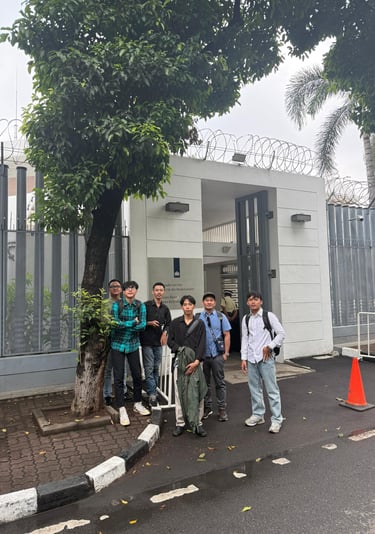 crew standing outside Netherland embassy after visa application