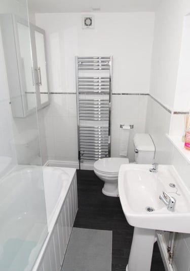 bathroom with over bath shower