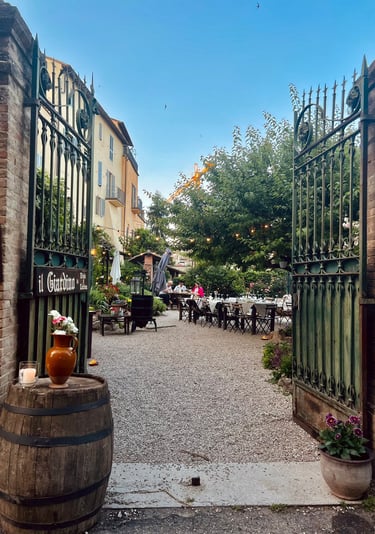 Il giardino San Gemini a gated in area with a barrel of wine