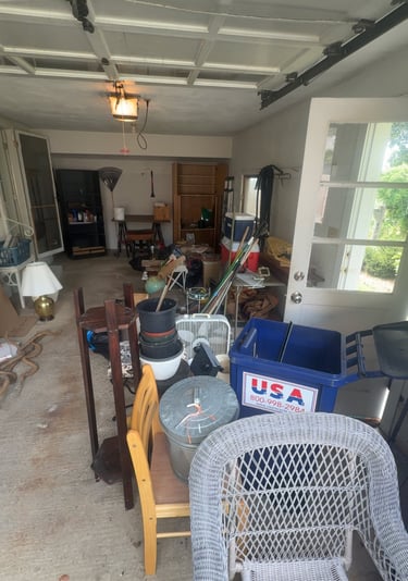 Garage filled with clutter before junk removal cleanout project