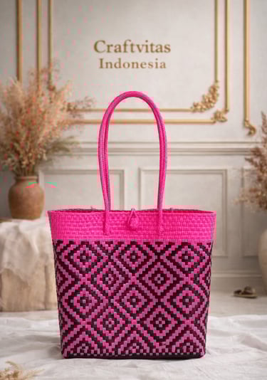 Pink and black handwoven plastic tote bag with geometric batik pattern, handmade Indonesian woven bag