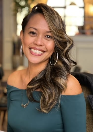 woman wearing teal blouse