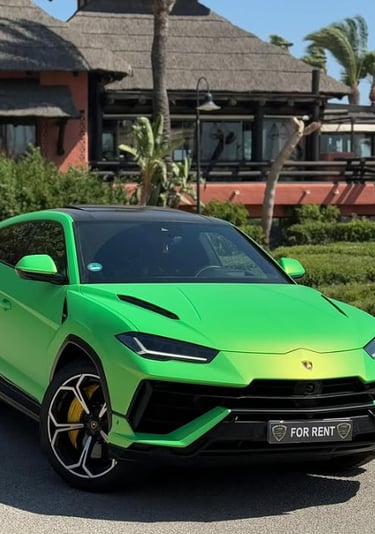 A lime green Lamborghini Urus luxury rental car parked outside a tropical resort.