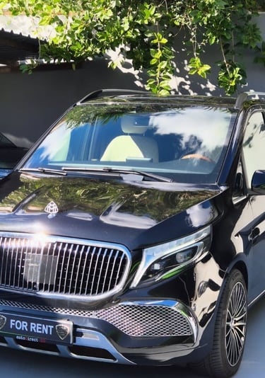 Luxury black Mercedes-Benz V-Class passenger van for rent with chrome grille and premium alloy wheels.