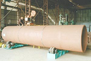 handling a large pipe in kiln burner manufacturing