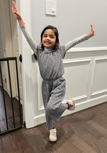 Young girl in a star position smiling