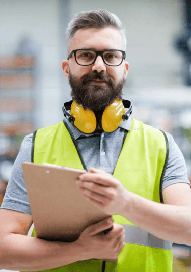 A warehouse employee on the floor with an pad