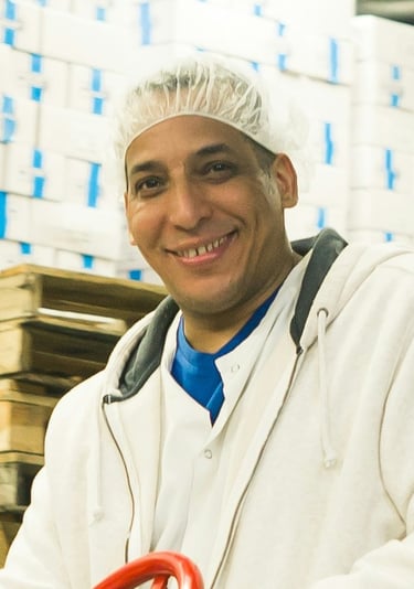 Warehouse employee smiling 