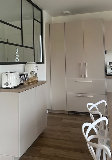 a kitchen with a table and chairs and a counter