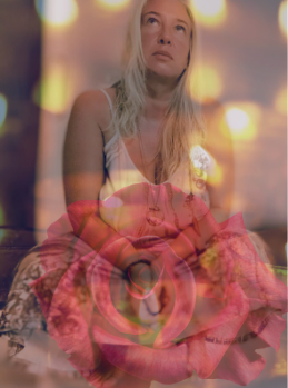 Maryann seated in reflection within a rose, symbolizing soul alchemy, feminine healing, and light