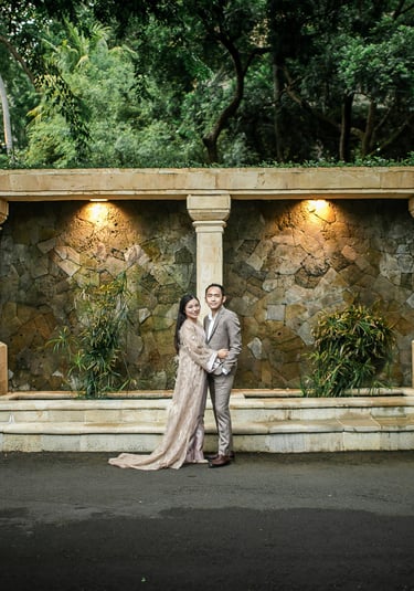 Prewedding portrait under stone arch courtyard at Amankila Karangasem Bali