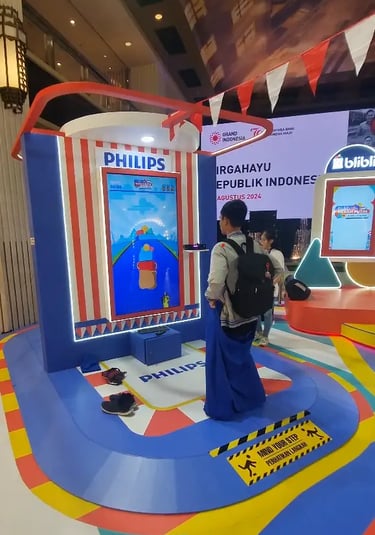 Kid playing digital sack race game using Kinect motion sensor at mall activation