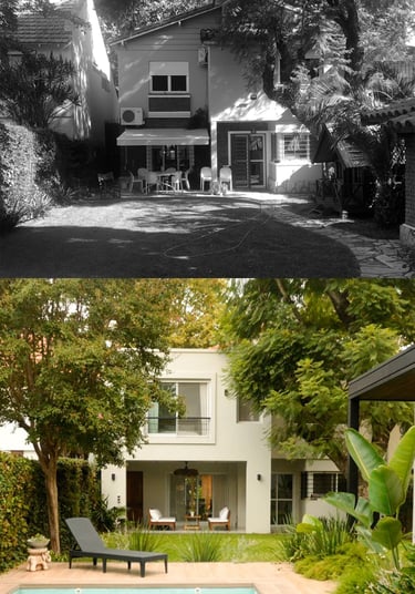 a black and white photo of a house with a pool and a pool